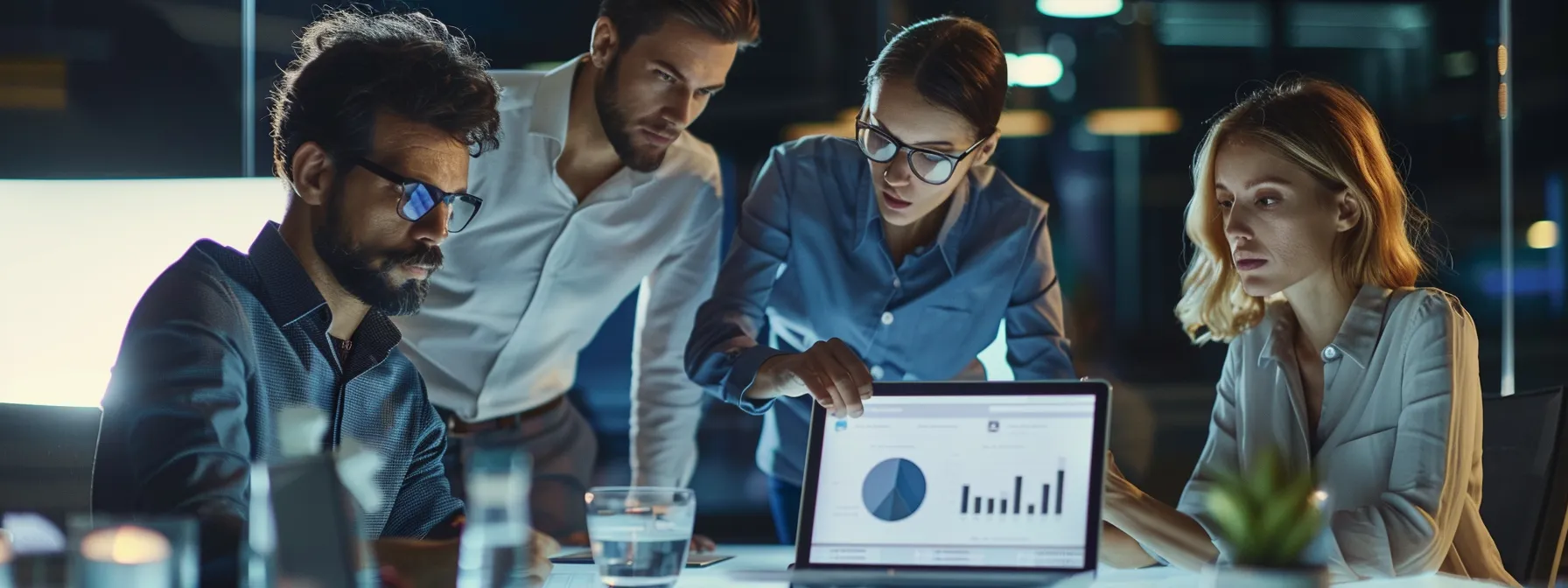 Key Factors That Determine BonusBandit's Sweepstakes Casino Trust Score 2 business professionals engaged in a focused discussion around a laptop displaying analytics.