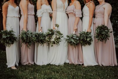 a group of women in dresses