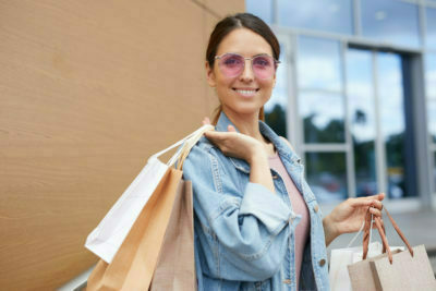 Home 32 a woman holding a bag